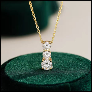 Three-stone moissanite necklace with 2 carat stones in gold-plated silver chain