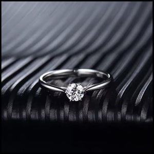 Diamond ring on a textured black surface