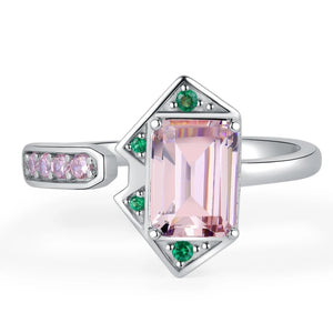 A silver ring featuring a pink and green emerald cut design, part of the MONICA Pink Ring COLLECTION.