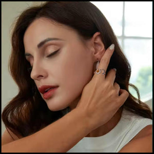 Woman wearing Moon & Star Silver Adjustable Ring with blue zirconia stones on finger