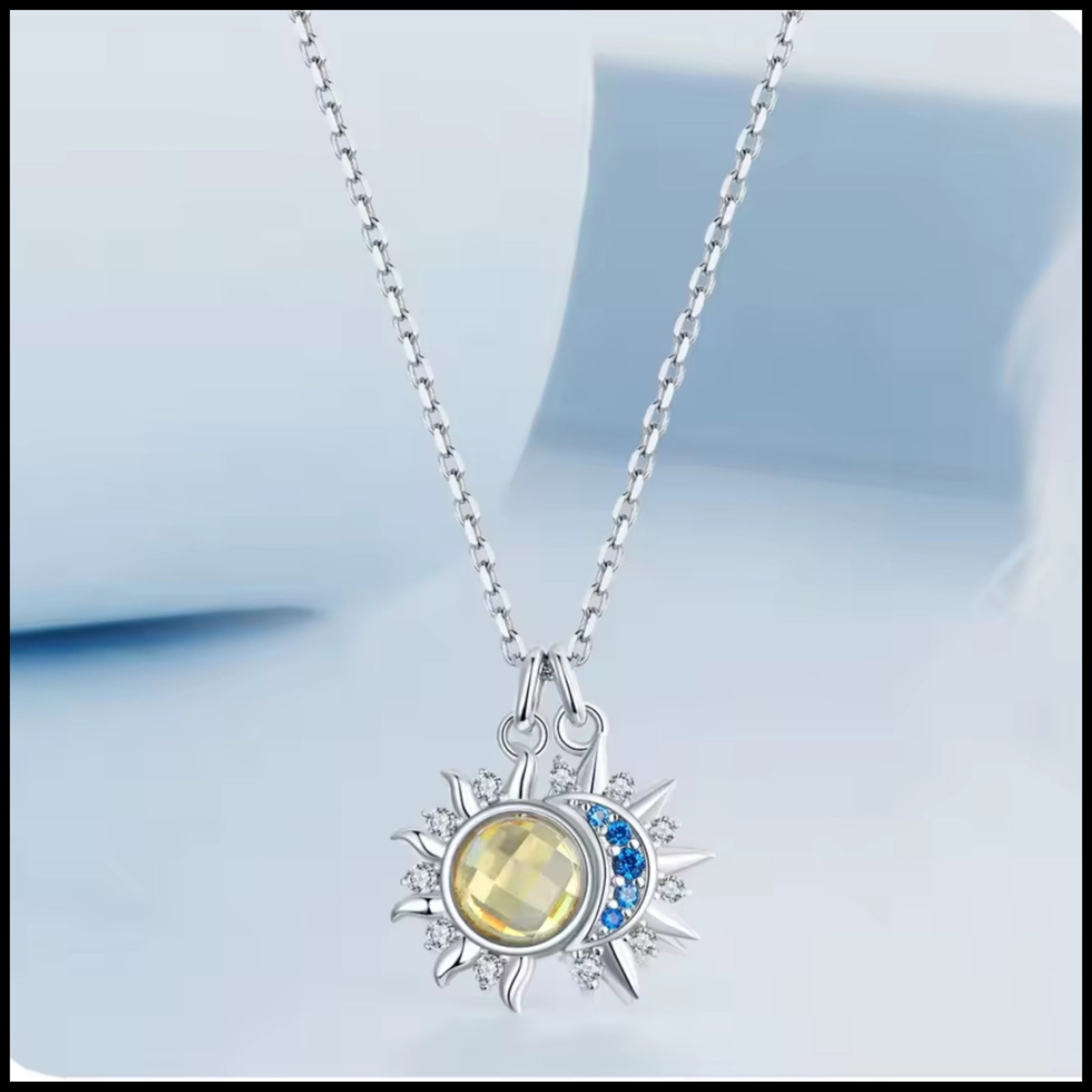 Moon & Star Silver Necklace with blue zirconia stones and celestial pendant design