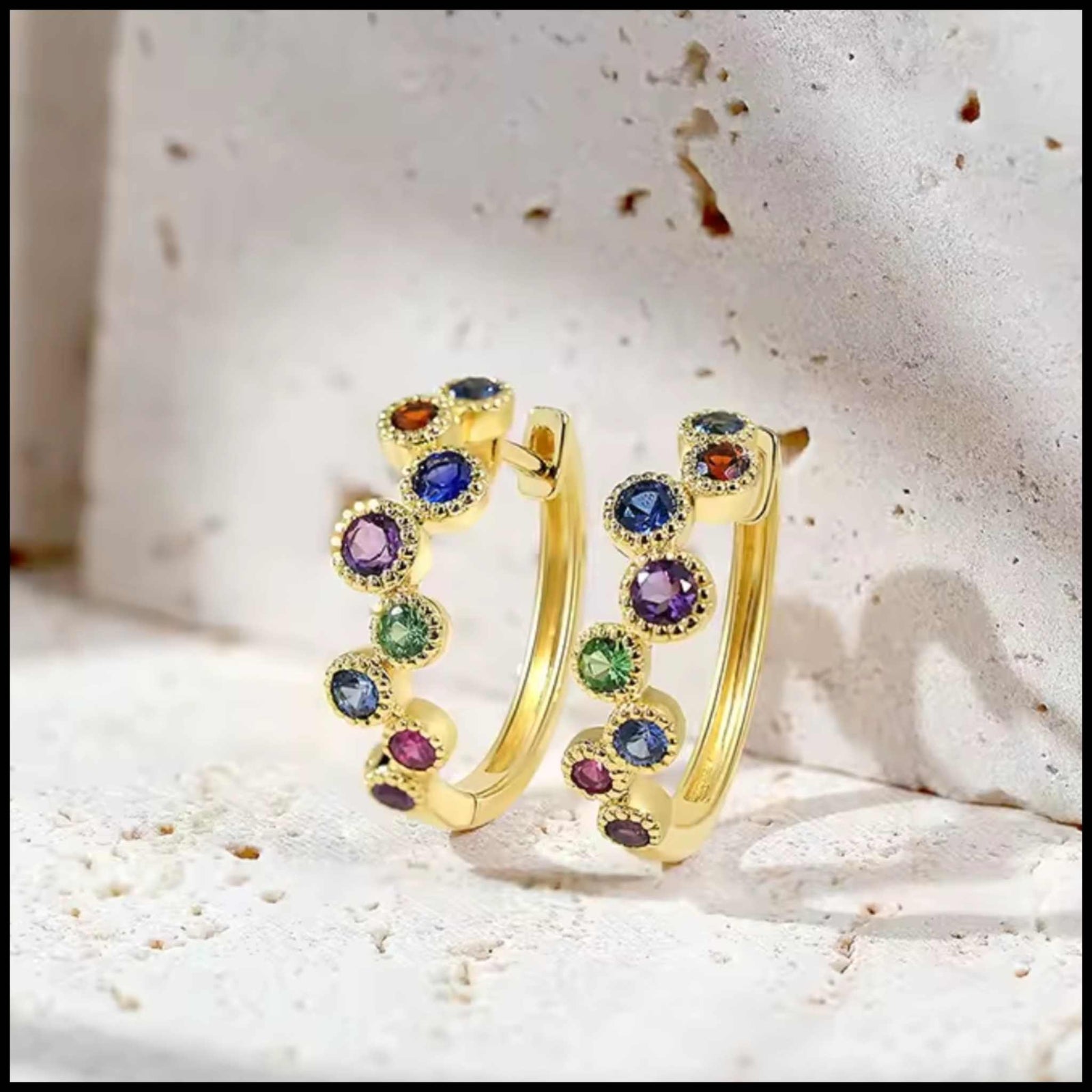 Ellie Multi-Gem Hoop Earrings in 14K yellow gold with rubies, garnets, amethysts, green garnets, and blue sapphires.