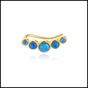 Gold earrings with blue opal stones on a white background