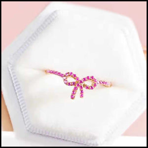Pink zircon bow ring in 14k gold-plated silver with minimalist design in white jewelry box