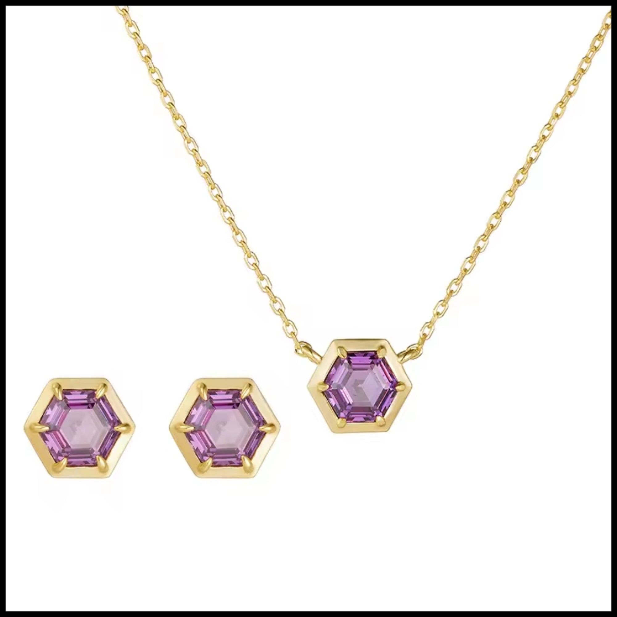 Gold necklace and earrings with purple gemstones on a white background