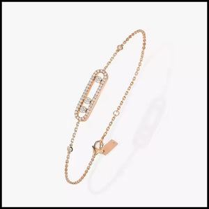 Rose gold bracelet with chain and clasp on a white background