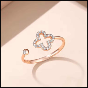 Rose gold plated adjustable four-leaf clover ring with cubic zirconia stones