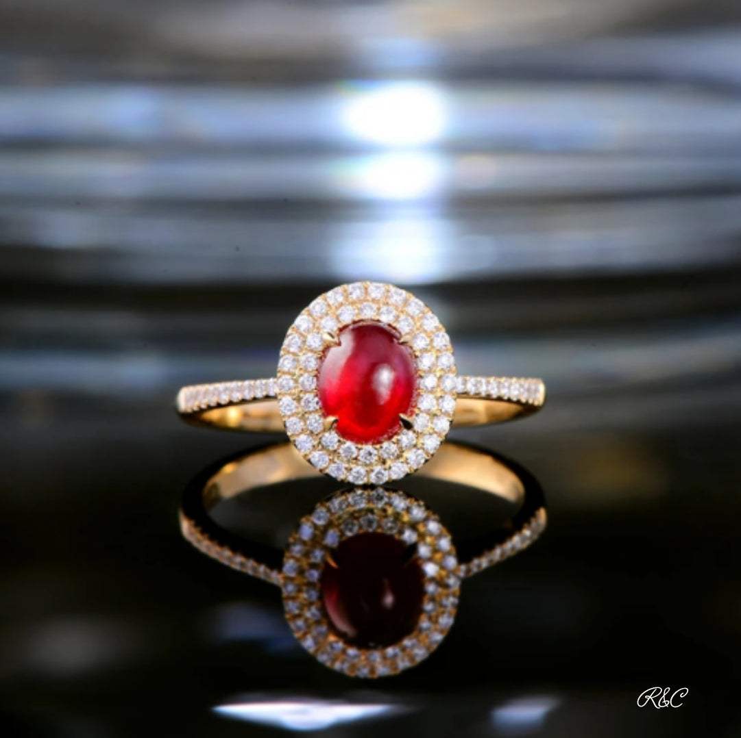 18K yellow gold Ruby Halo Diamond ring with cabochon ruby center and diamond halo