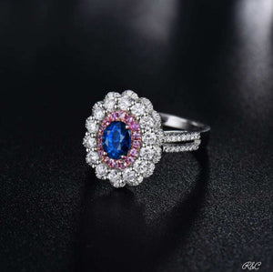 Meghan Sapphire & Diamonds 18K white gold ring with oval blue sapphire, pink sapphires, and round diamonds dual design ring