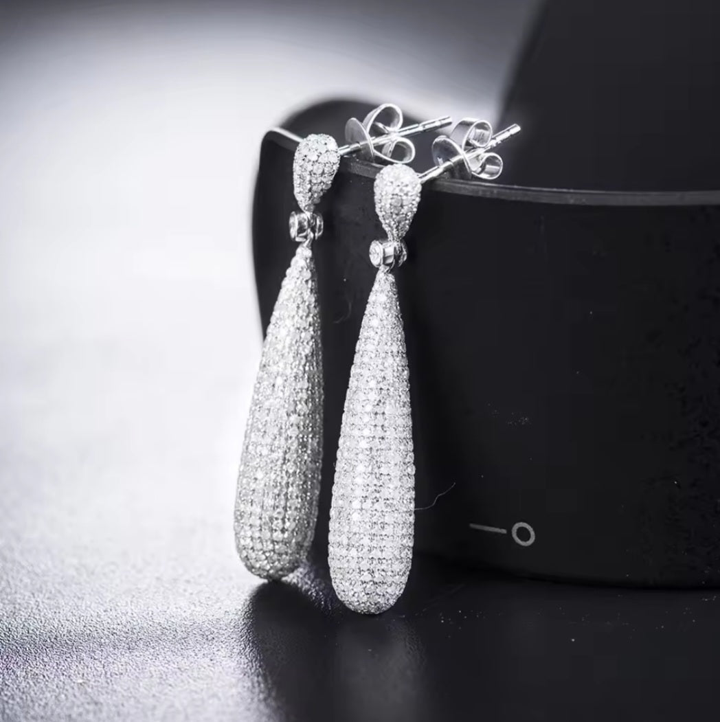 Elegant diamond drop earrings in 14k white gold with sparkling round-cut diamonds for special occasions.