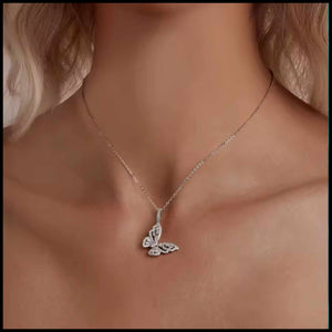 Butterfly necklace with diamonds on a person's neck