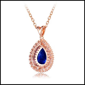 Tanzanite diamond rose gold necklace with pear-shaped blue tanzanite and surrounding diamonds