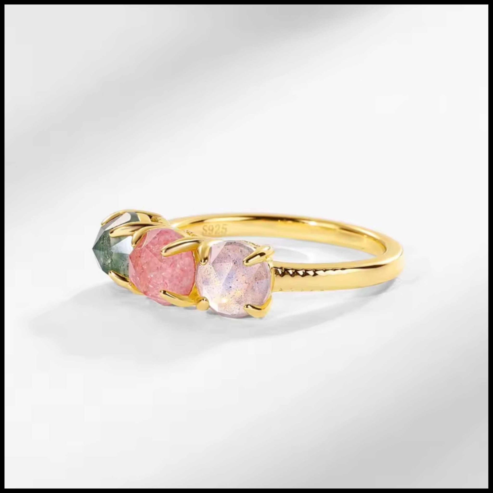 Three-stone gold ring with rose quartz, green moss agate, and labradorite gemstones on 10k yellow gold plated silver band
