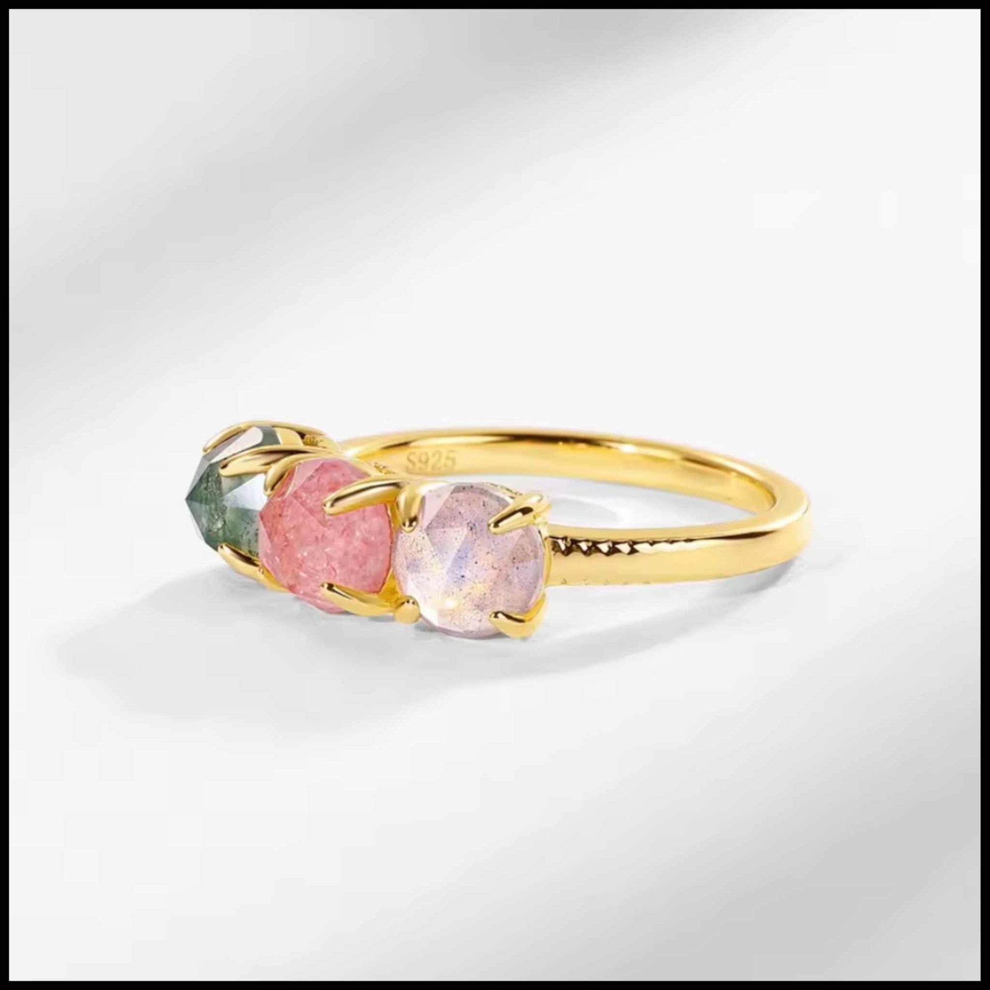 Three-stone gold ring with rose quartz, green moss agate, and labradorite gemstones on 10k yellow gold plated silver band
