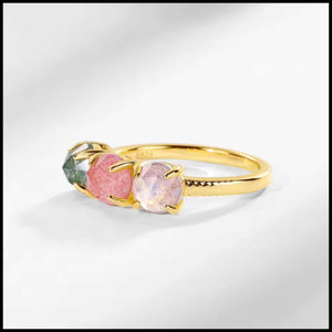 Three-stone gold ring with rose quartz, green moss agate, and labradorite gemstones on 10k yellow gold plated silver band