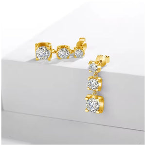 Three-stone moissanite drop earrings in yellow gold with graduated sparkling stones