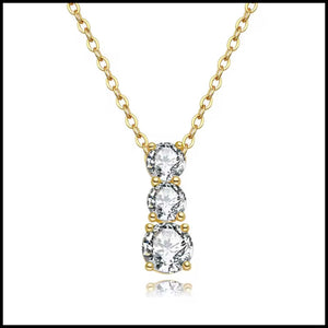 Three-stone moissanite necklace with 2 carat stones set in triple-layer gold plated silver chain