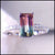 Ring with a green gemstone and diamond-studded band on a light gray background