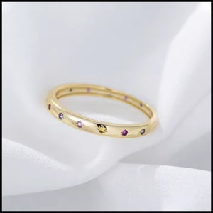 R&C Minimalistic Gold Multi-coloured band ring with gold plating and multi-coloured zirconia stars on solid silver band