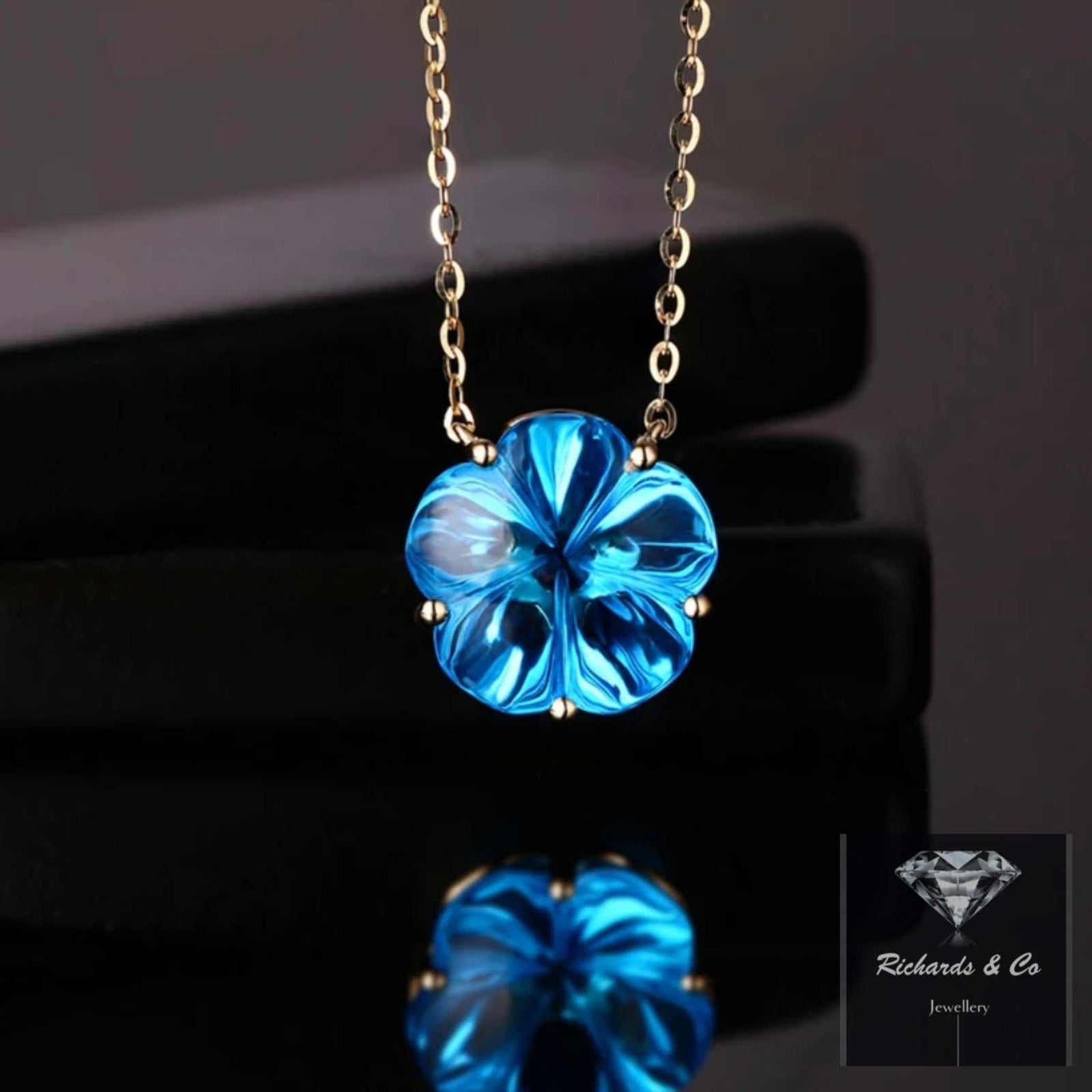 Blue Topaz Flower Design necklace in 18K yellow gold with 10.43ct Swiss blue topaz pendant