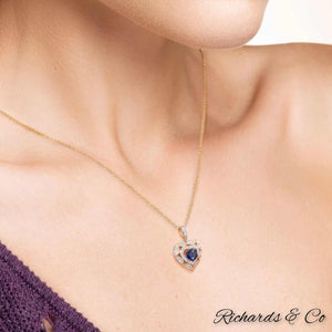 Collection - DEVOTION heart necklace pendant with sapphire and diamonds in 14K yellow gold worn on neck