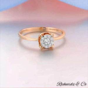 Diamond engagement rose gold ring with round brilliant diamonds in four-prong setting