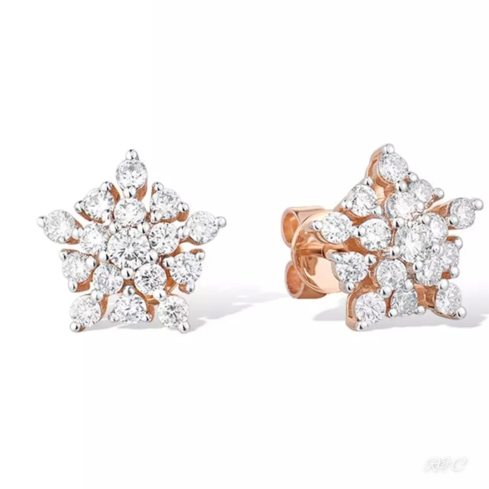 A pair of rose gold stud earrings with a star shape design, featuring natural round cut diamonds.