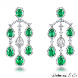 High end luxury chandelier earrings with natural emeralds and diamonds in 18K white gold