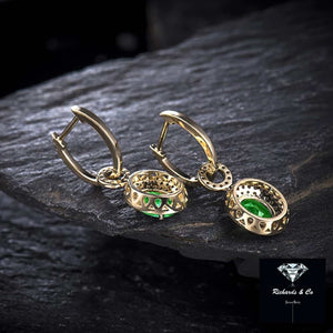 14k gold emerald and diamond drop earrings with oval 1.57ct VS clarity emeralds and 0.82ct SI clarity diamonds, elegant and luxurious design