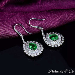 Clarity Drop Emerald & Diamond Earrings in 18k white gold with pear-shaped emeralds and round baguette diamonds