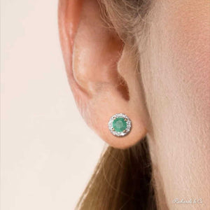 BIANCA Collection 14K gold stud earring with round cut natural emerald and surrounding diamonds worn on ear