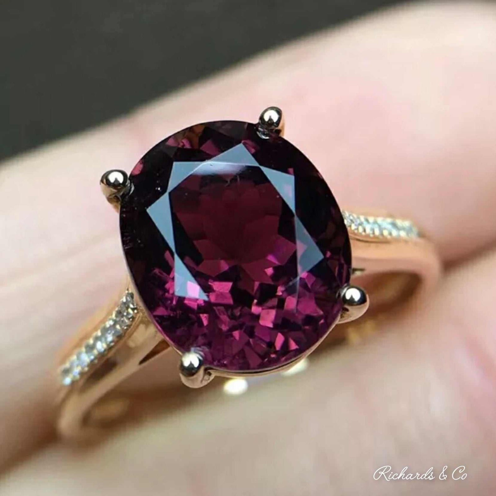 18K yellow gold Purple Tourmaline & Diamond Ring with oval deep purple tourmaline and round diamonds on band