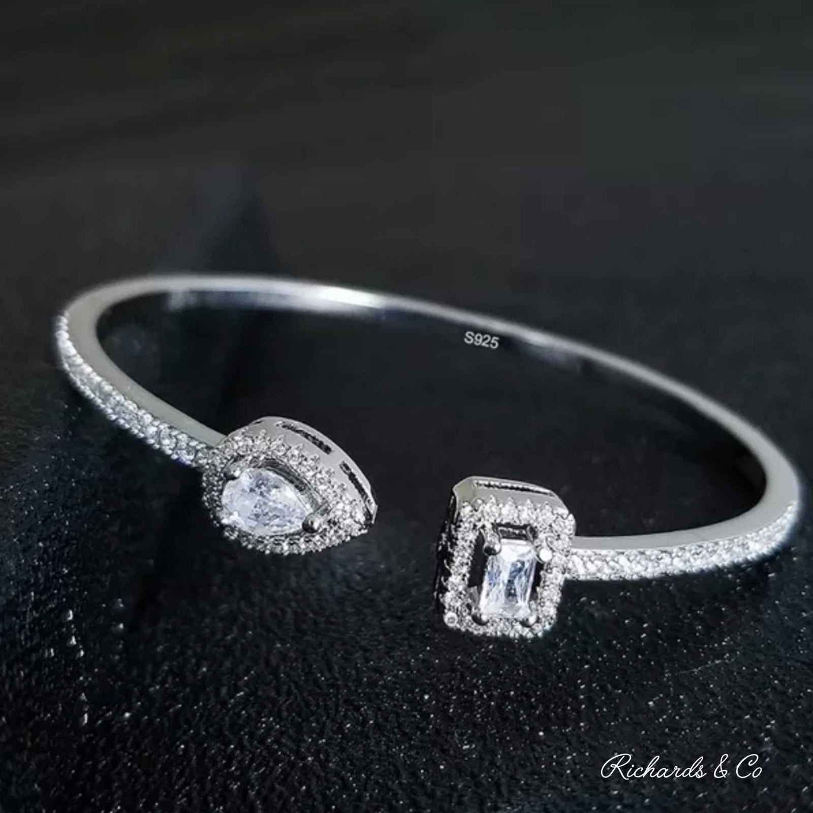 Silver Zirconia pear-shaped sterling silver bangle with sparkling zirconia stones and water drop design