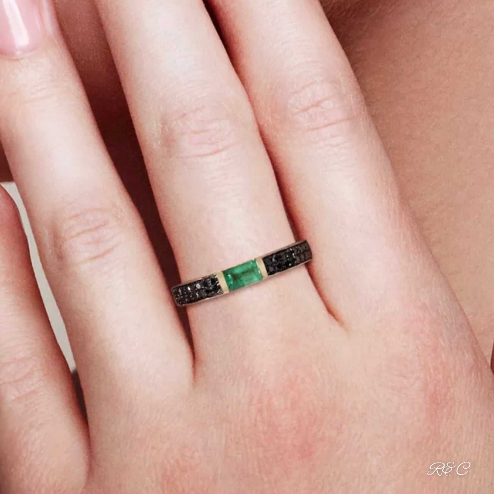 14K yellow gold band ring with natural octagon emerald and black diamonds tension mount