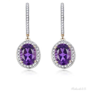 Elegant purple amethyst and diamond drop earrings set in 14k yellow gold
