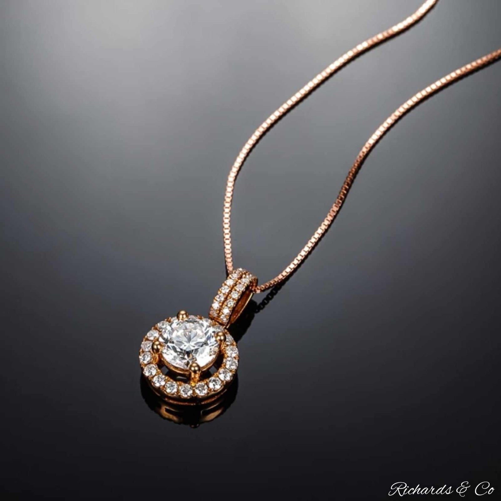 Elegant diamond necklace 18K rose gold with 0.43ct flawless diamonds pendant on black background