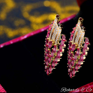 Elegant 14K gold pink ruby and diamond stud earrings with marquise-cut rubies and round natural diamonds