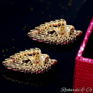 Close-up of SAINTLY Pink Ruby & Diamond Earrings with intricate gold filigree and marquise-shaped pink rubies set in 14K yellow gold