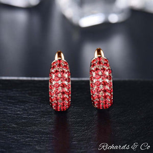 Bella Earrings in rose gold with natural ruby and diamond accents, luxury handcrafted hoop studs.
