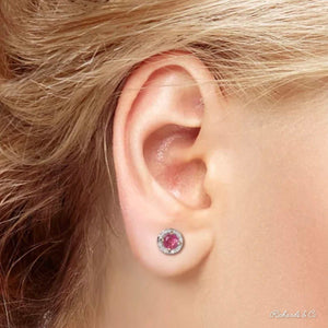 BIANCA Collection 14K gold stud earrings with round ruby gemstone and diamond halo on ear