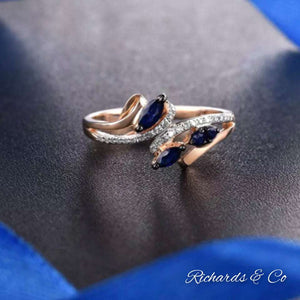 14K rose gold ring with marquise blue sapphires and round cut diamonds in prong setting sapphire & diamond jewelry