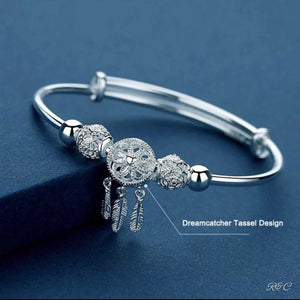 Elegant Dream Catcher Silver Bracelet with intricate tassel charms and adjustable solid silver bangle design