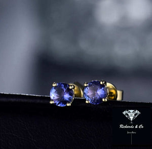 Natural Tanzanite stud earrings with 14K yellow gold round 5mm gemstones displaying violet blue hues and pleochroism