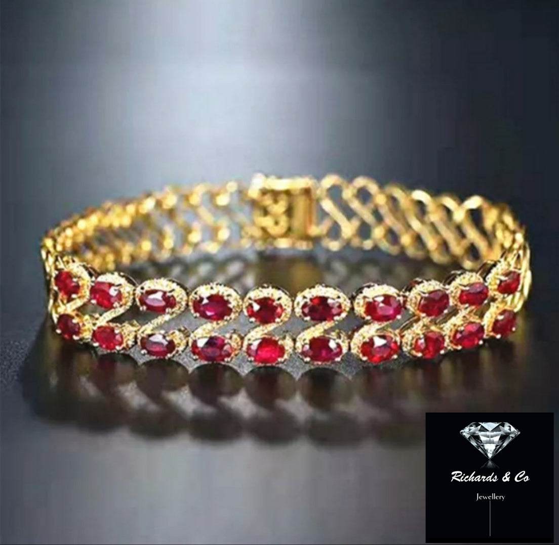 18K yellow gold Ruby & Diamond gold bracelet with vivid red oval rubies and diamonds chain link design