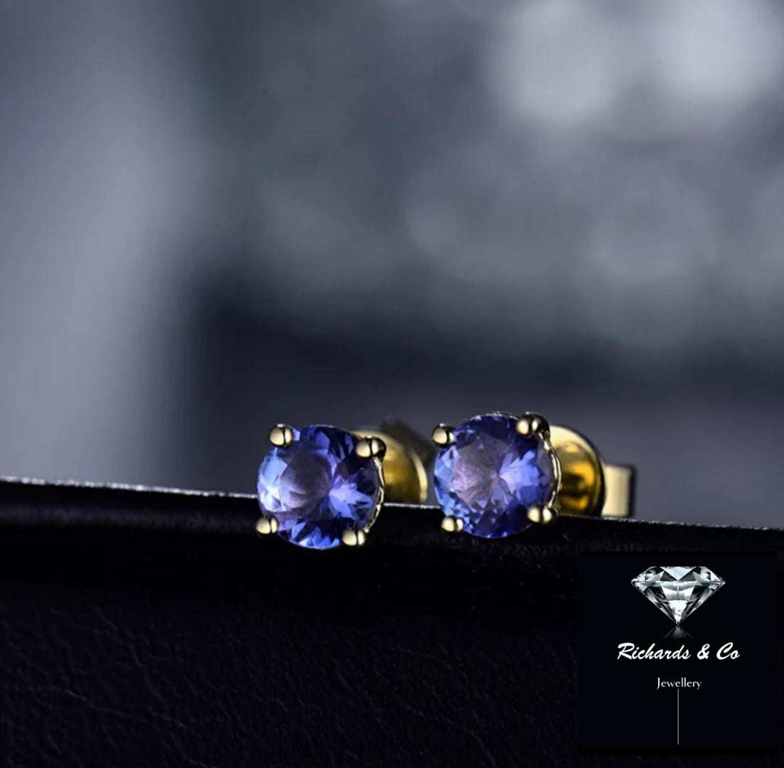 Natural Tanzanite stud earrings with 14K yellow gold round 5mm gemstones displaying violet blue hues and pleochroism