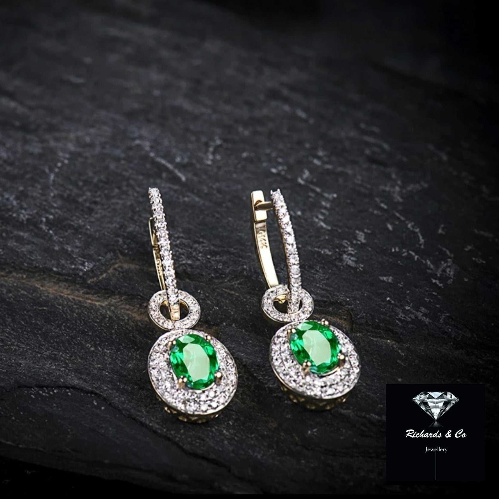 14k gold emerald and diamond drop earrings with oval 1.57ct VS clarity emeralds and 0.82ct SI clarity diamonds