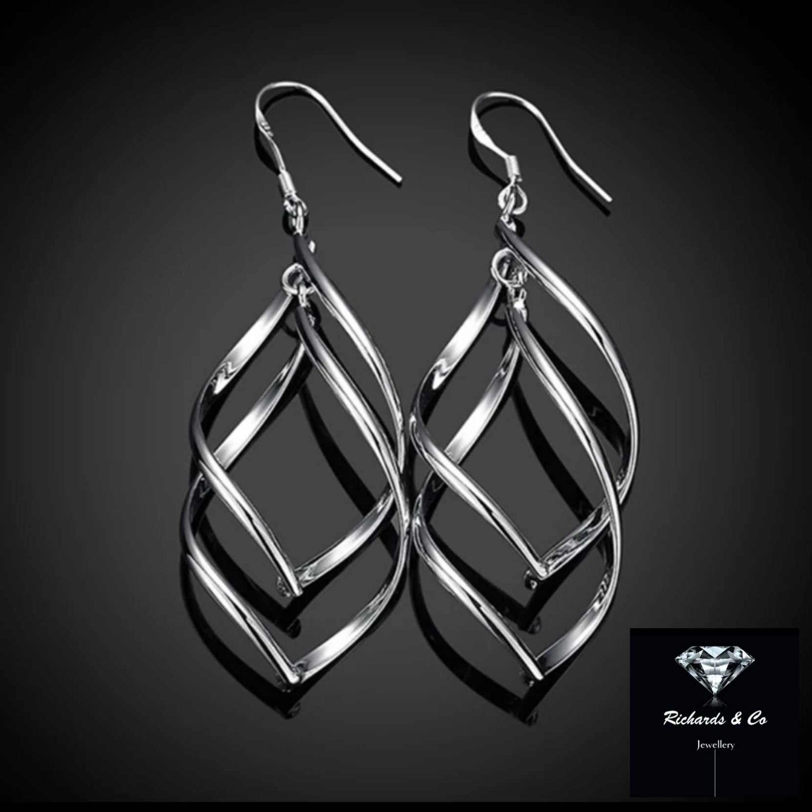 spiral silver drop earrings with elegant twisted design sterling silver handcrafted lightweight pair