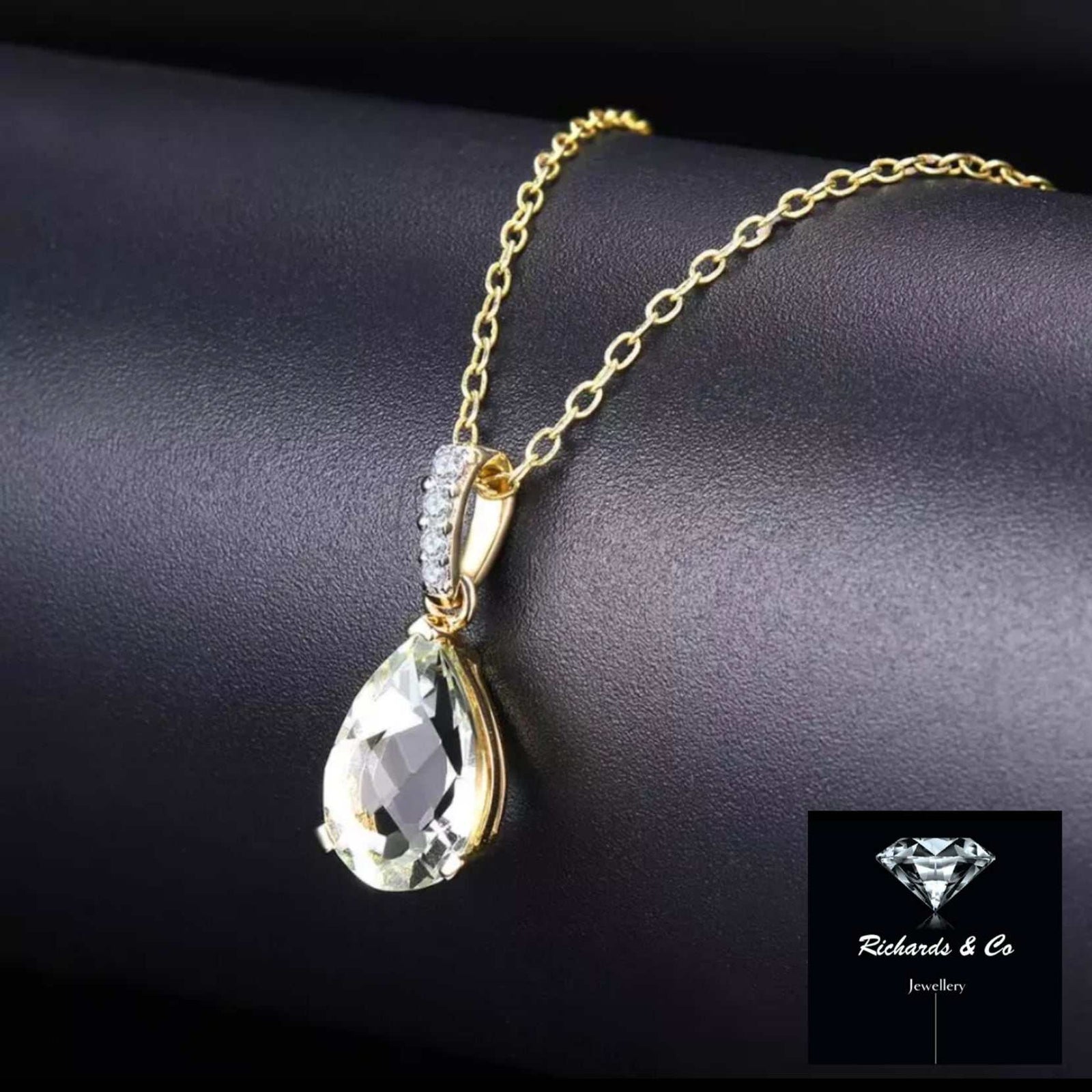 Natural green amethyst and diamond pendant necklace in 14k yellow gold with 18-inch chain, symbolizing good fortune