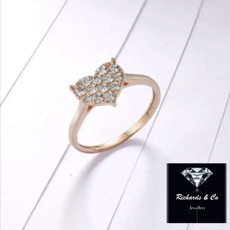 14K yellow gold heart shaped diamond ring with 0.40ct round diamonds in tension mount band