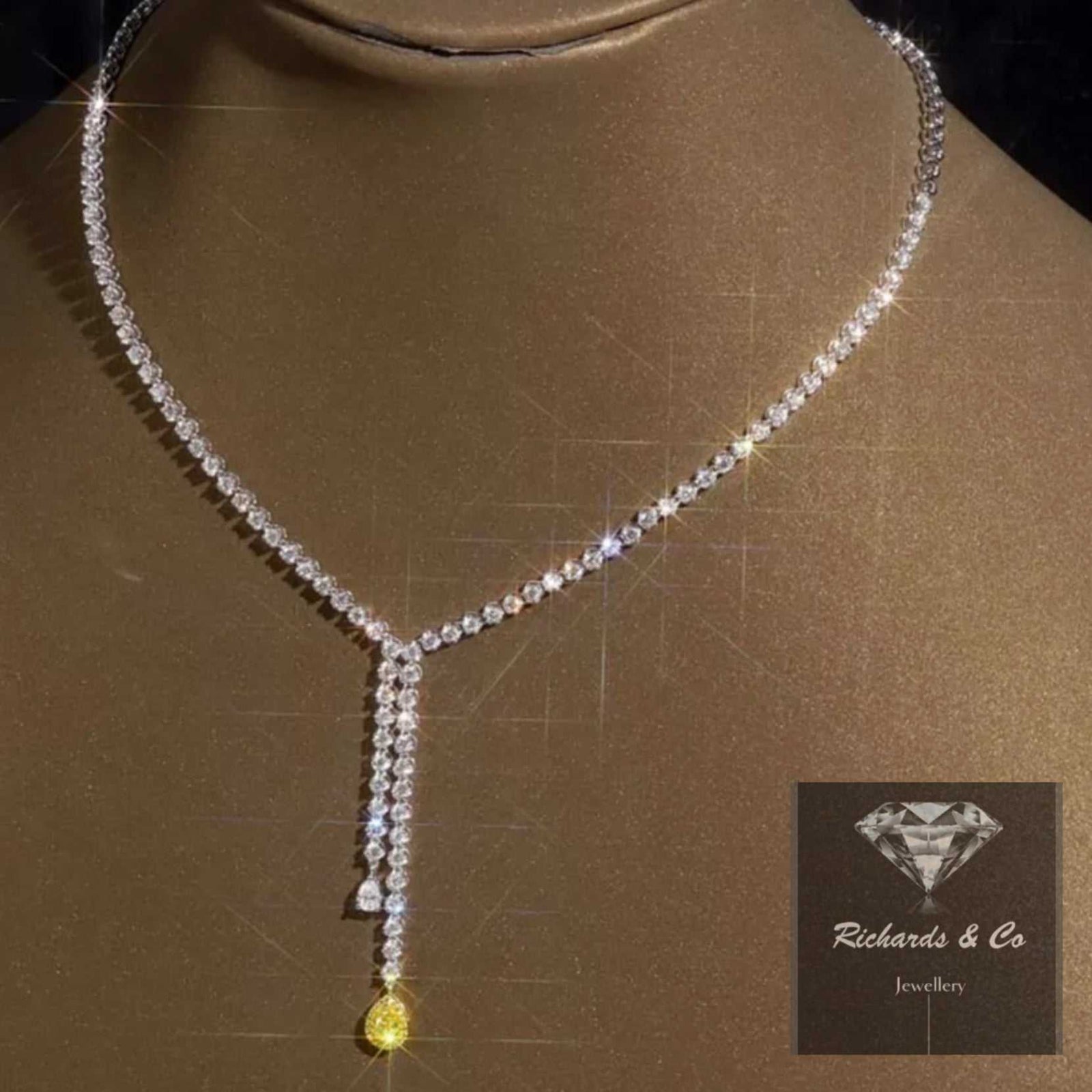 Elegant luxury diamond necklace with fancy yellow diamond drop and 18K white gold chain